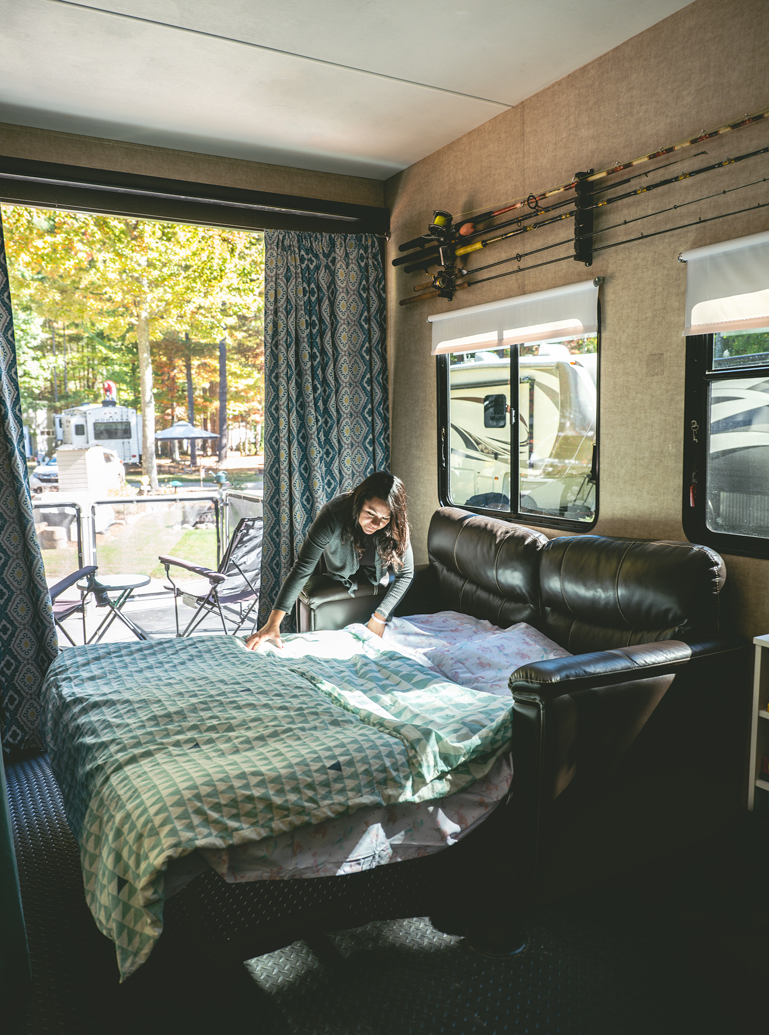 Sandra making a pull-out bed in the garage space of their toy hauler RV.